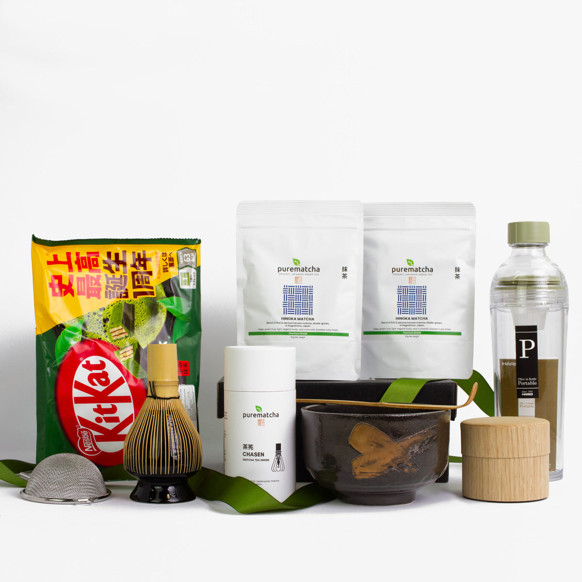 Ultimate Matcha Starter Kit Collection of tea-related products including Kit Kat, matcha powder, and tea-making tools on a white background.