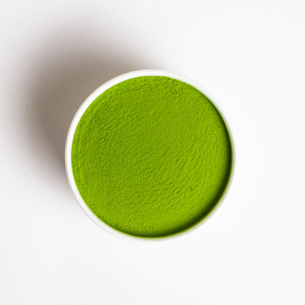 EISAI Ceremonial Uji Matcha Green tea powder in a white bowl on a white background