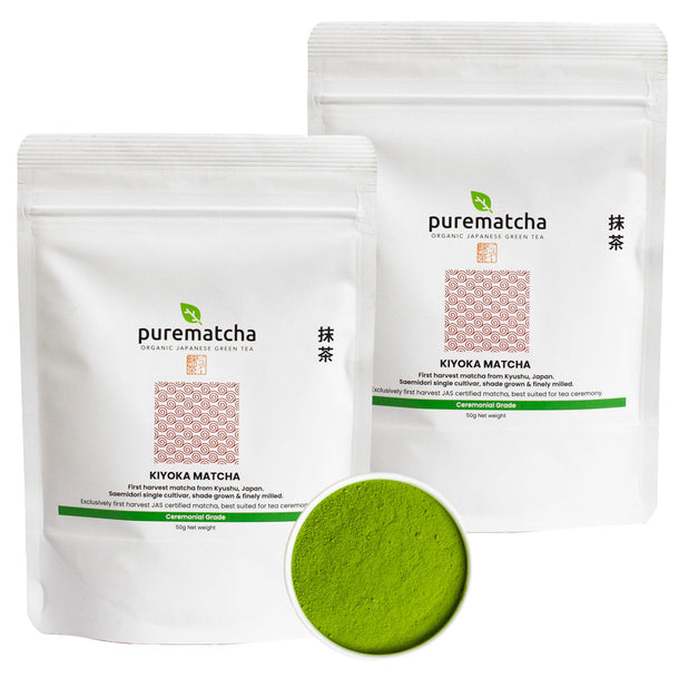 Two packages of purematcha Kiyoka Matcha with a scoop of green powder on a white background.