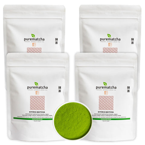 Four packages of purematcha green tea powder with a small bowl of green powder in the center.