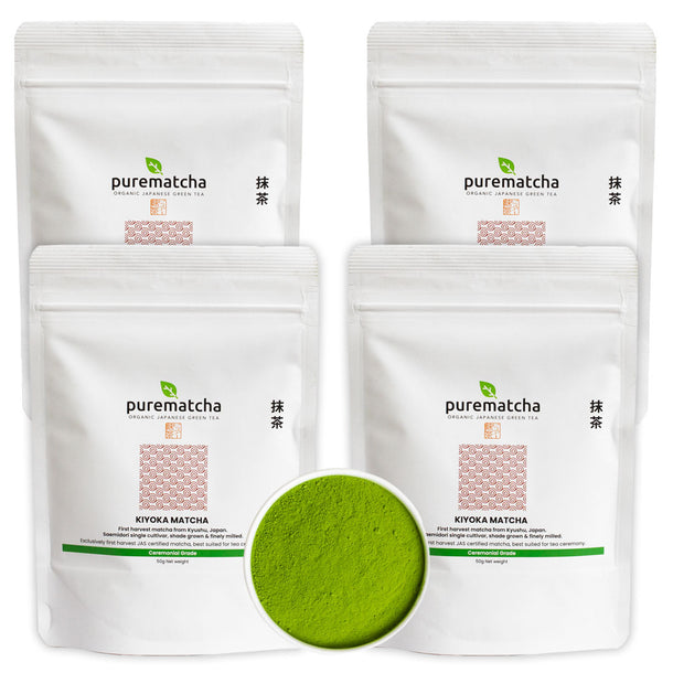 Four packages of purematcha green tea powder with a small bowl of green powder in the center.