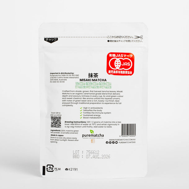 Back of a white matcha packaging with text and logos on a white background