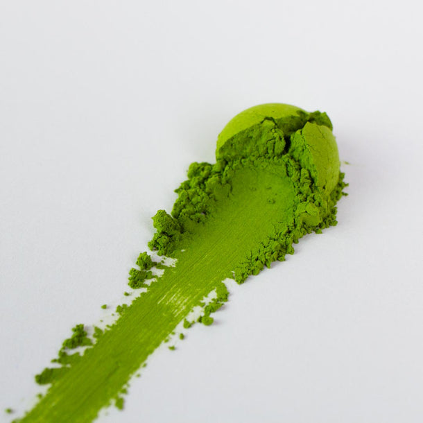 ceremonial grade matcha green tea powder streak on white paper