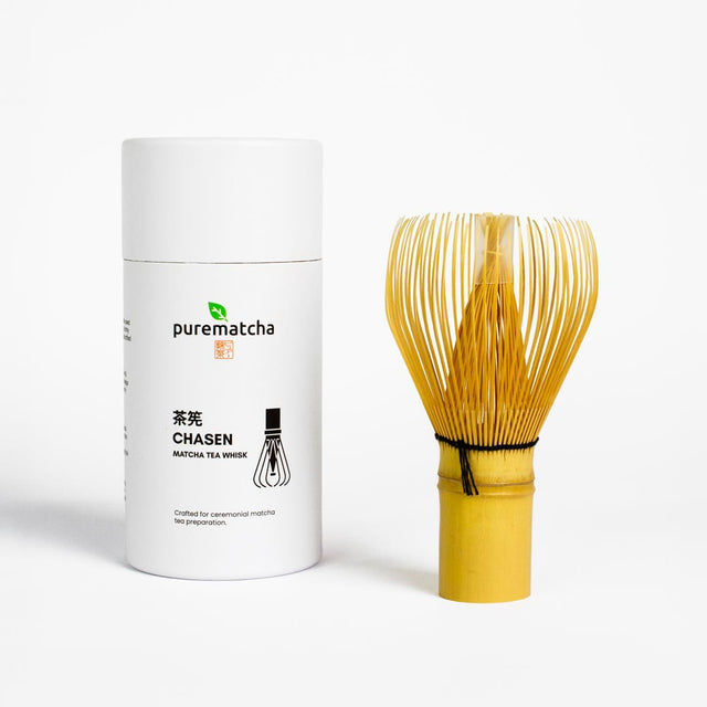 White container labeled 'purematcha' with a yellow whisk on a white background