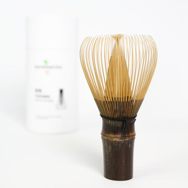Bamboo whisk used for making matcha tea on a white background